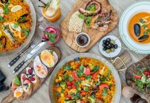 İspanyol Mutfağı İspanyol mutfağı, Akdeniz ikliminin sunduğu bereketli tarım ürünleri ve tarih boyunca süregelen kültürel etkileşimlerle şekillenmiştir. Fenikelilerden Romalılara, Araplardan Yeni Dünya keşiflerine kadar uzanan süreç, mutfağın bugünkü zenginliğinin temelini oluşturur. Arap etkisi, özellikle baharatların, pirincin ve zeytinyağının mutfakta önemli bir yer edinmesini sağlamıştır. Konulu bir haber görseli.